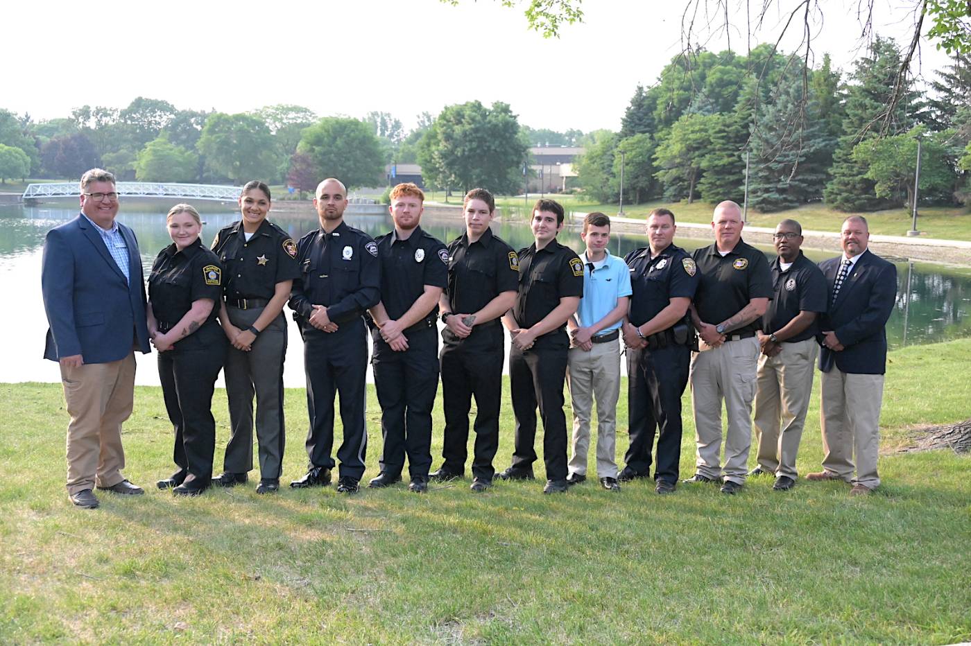 Police office training academy class group photo on campus outdoors